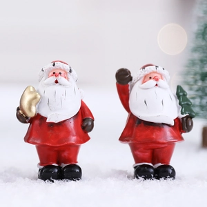Nordic resin Santa Claus figurines with gold gift bag on snow for Christmas decor