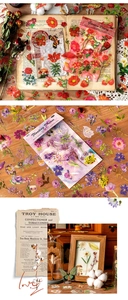 Close-up of vintage floral scrapbooking stickers with Garden Diary and Floating Dream designs