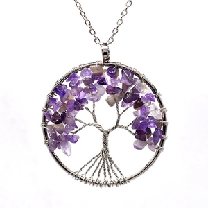 Silver tree of life necklace with purple amethyst crystal stones on a white background