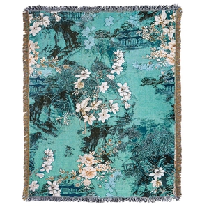 Lake blue woven tapestry blanket with landscape floral patterns and tassel edges