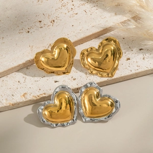 Fashionable 18K gold heart stud earrings in gold and silver mixed tones on stone