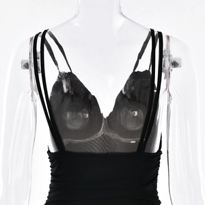 Detail view of black deep V-neck mesh dress with pleated texture and thin straps