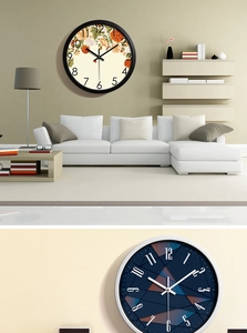 Detail of minimalist 30cm metal wall clocks with floral and geometric dial designs
