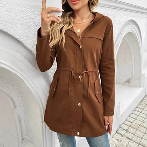 Close-up of brown utility jacket with drawstring waist and metallic button details