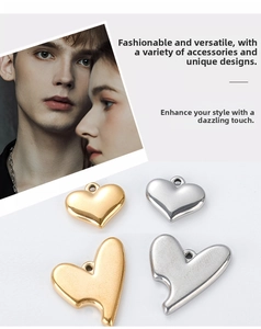 Detailed view of polished gold and silver heart-shaped metal charms for DIY jewelry making