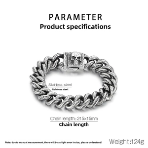 Detail of chunky stainless steel Cuban link bracelet with skull buckle and dimensions