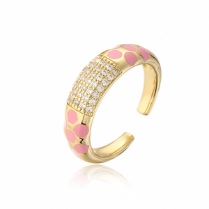 Detail of adjustable 18K gold ring with pink enamel dots and rows of white zircons