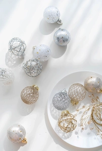Close-up of elegant gold and silver Christmas ball ornaments with detailed mesh textures