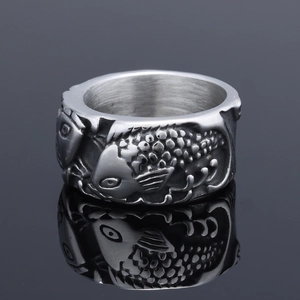 Silver fish pattern stainless steel ring with 3D koi fish relief on gray mirror background