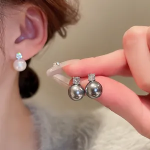 Elegant pearl stud earrings with sparkling round zirconia and silver pin for women
