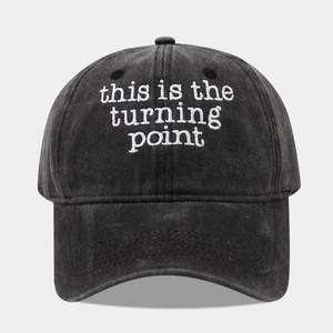 Vintage washed cotton baseball cap in black with white 'turning point' letter embroidery