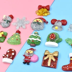Glitter Christmas resin accessories featuring Santa, tree, and snowman for DIY crafts