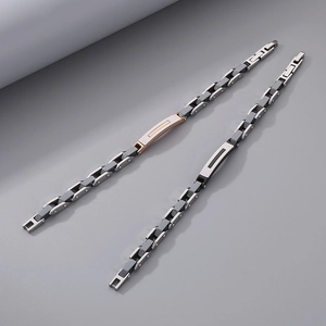Industrial stainless steel linked bracelet with curved plaque in black and rose gold