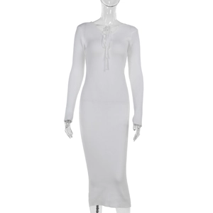 Detail of white slim fit ribbed knit dress showing tie-up neckline and long sleeves