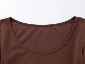 Detailed macro view of the cocoa brown knit fabric and U-neckline on the bodysuit