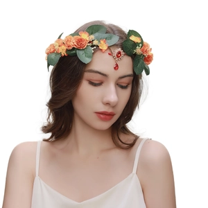 Baroque forehead pendant with gold leaves and colorful floral wreath on white background