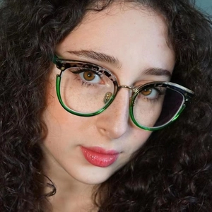 Detail of green semi-rimless frames with leopard print brow and metal nose bridge