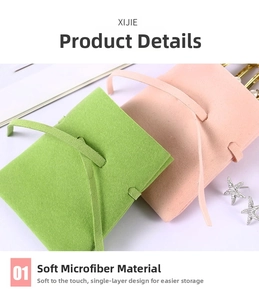 Detail of pink and green microfiber jewelry pouches with soft texture and drawstring