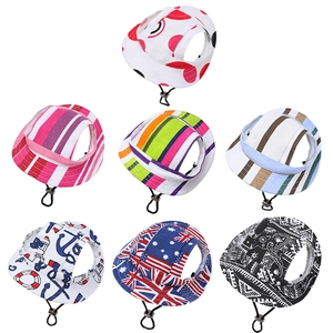 Summer pet sun hats in various patterns including flag and stripes with adjustable cords