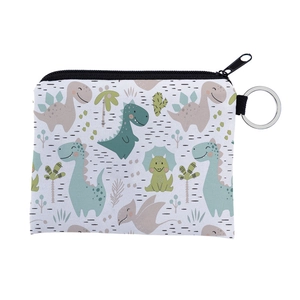 Detail view of cartoon dinosaur coin purse with sturdy black zipper and metal keychain ring