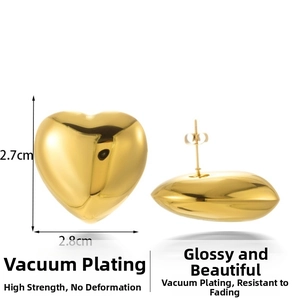 Detail view showing 2.7cm x 2.8cm dimensions of golden hollow heart stud earrings