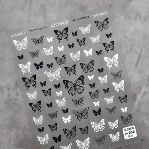 Macro detail of ultra-thin butterfly nail art stickers in black and white styles