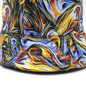 Artistic double-sided bucket hat with colorful abstract tie-dye patterns for summer sun protection
