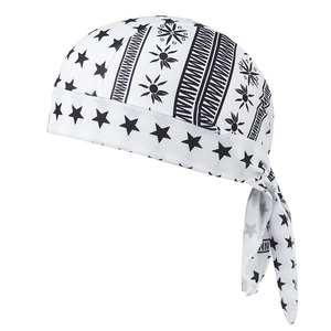 Detail of white paisley doo-rag featuring black star and geometric patterns with ties