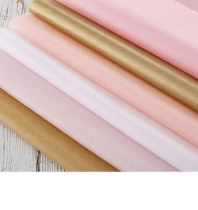 Close-up of colorful tissue paper stack showing soft texture and semi-transparent layers