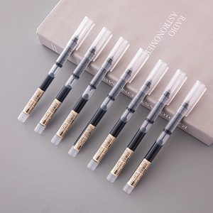 Close-up of seven 0.5mm black liquid ink pens on a book with semi-transparent frosted barrels