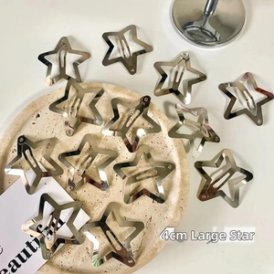 Detailed view of silver Y2K star hair clips featuring a 4cm metallic pentagon design