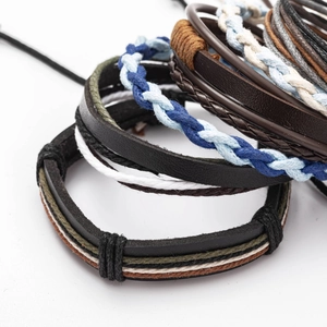 Detailed view of multilayer leather and braided hemp rope bracelets in mixed colors