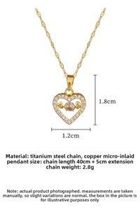 Close-up of heart pendant with micro-pave white zircons on a gold titanium steel chain