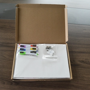 Unboxing clear acrylic weekly calendar set with colorful magnetic markers and mounting pads