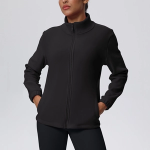 Detail of a black full-zip athletic jacket featuring a stand collar and side pockets