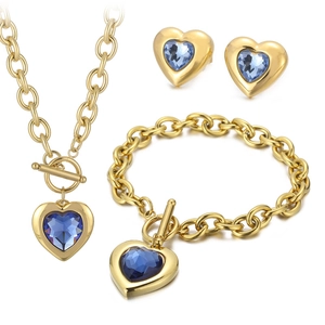 Golden heart jewelry set with blue crystals, OT toggle necklace, bracelet, and earrings