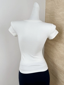Detailed macro view showing the white ribbed knit texture of this slim fit short sleeve T-shirt