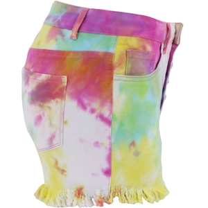 Macro detail of colorful tie-dye high-waist denim shorts with distressed fringe hem