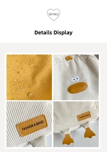 Close-up of waterproof corduroy texture and duck embroidery on the student backpack