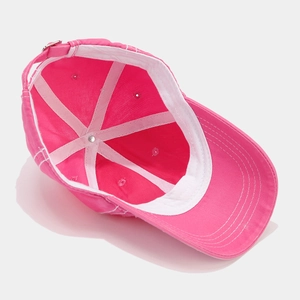 Detailed interior view of pink baseball cap showing white sweatband and reinforced stitching