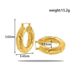 Textured gold chunky hoop earrings with measurement dimensions and detailed metal finish