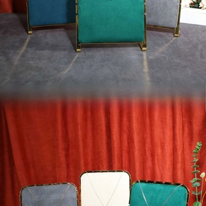 Detail of solid wood jewelry stand with velvet finish and gold metal frame for necklaces