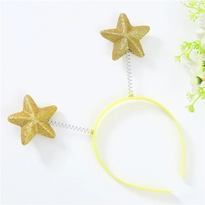 Close-up of sparkling gold glitter star decorations on yellow spring headband for kids