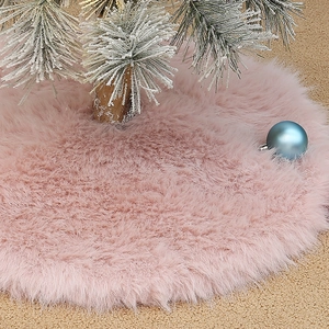 Pink faux fur Christmas tree skirt with plush texture for holiday base decorations