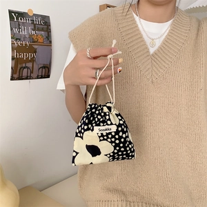 Close-up of small floral drawstring pouch in Japanese style with Sozakka brand label