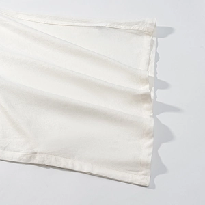 Elegant white V-neck batwing blouse with premium natural linen texture and wide-edge seams