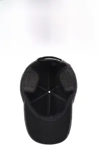 Detail of dark grey winter baseball cap with thick black lining and ear protection