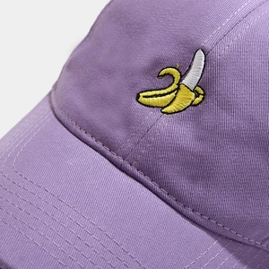 Purple cotton baseball cap with cute banana embroidery featuring a curved brim