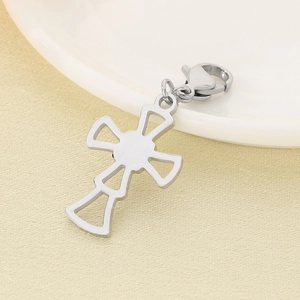 Detailed view of a silver hollow cross pendant with lobster clasp for DIY accessories