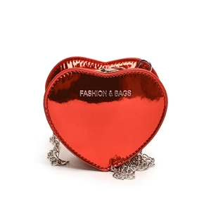 Glossy red heart-shaped crossbody bag with silver chain strap and fashion print